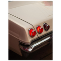 Close-up of a vintage car chevy impala rear lights with a beige body.